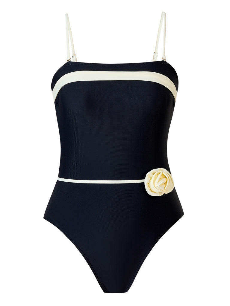 She's wearing Black 1940s Contrast 3D Rose Belted Swimsuit and the whole beach remembers the 1940s