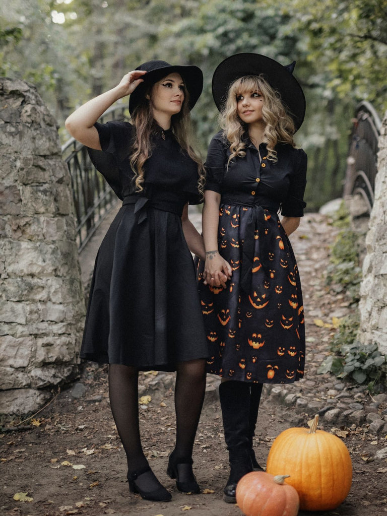 She slips into this Black 1940s Halloween Lapel Pumpkin Belted Dress and suddenly it's a 1940s daydream