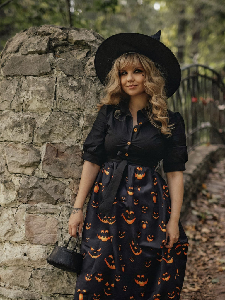 She slips into this Black 1940s Halloween Lapel Pumpkin Belted Dress and suddenly it's a 1940s daydream