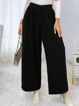 She walks in these Black 1940s Solid Pleated Waist Straight Pants and the world follows