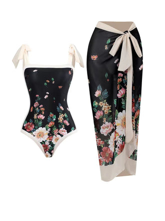 She's wearing Black 1940s Strap Bow Floral Swimsuit & Cove-Up and the whole beach remembers the 1940s