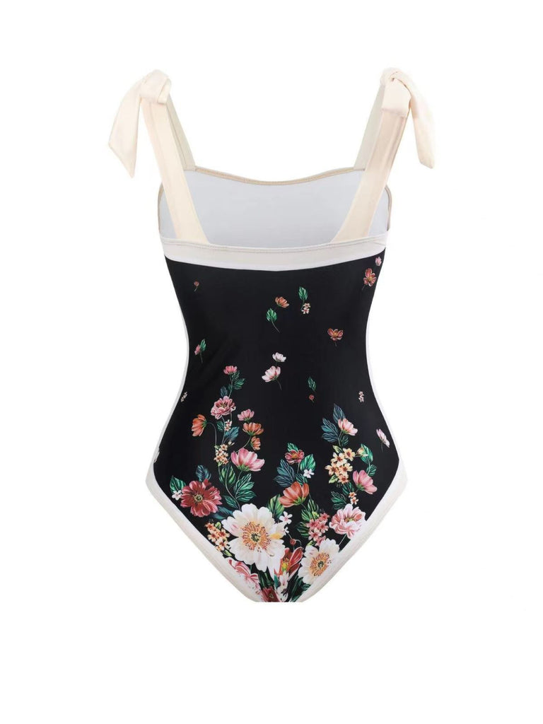 This Black 1940s Strap Bow Floral Swimsuit & Cove-Up carries 1940s vacation dreams in every stitch