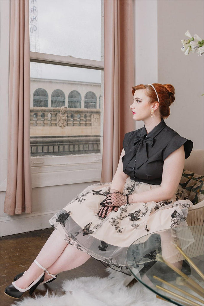 This Black 1950s Butterfly Patchwork Vintage Dress wraps her in 1950s elegance, one twirl at a time