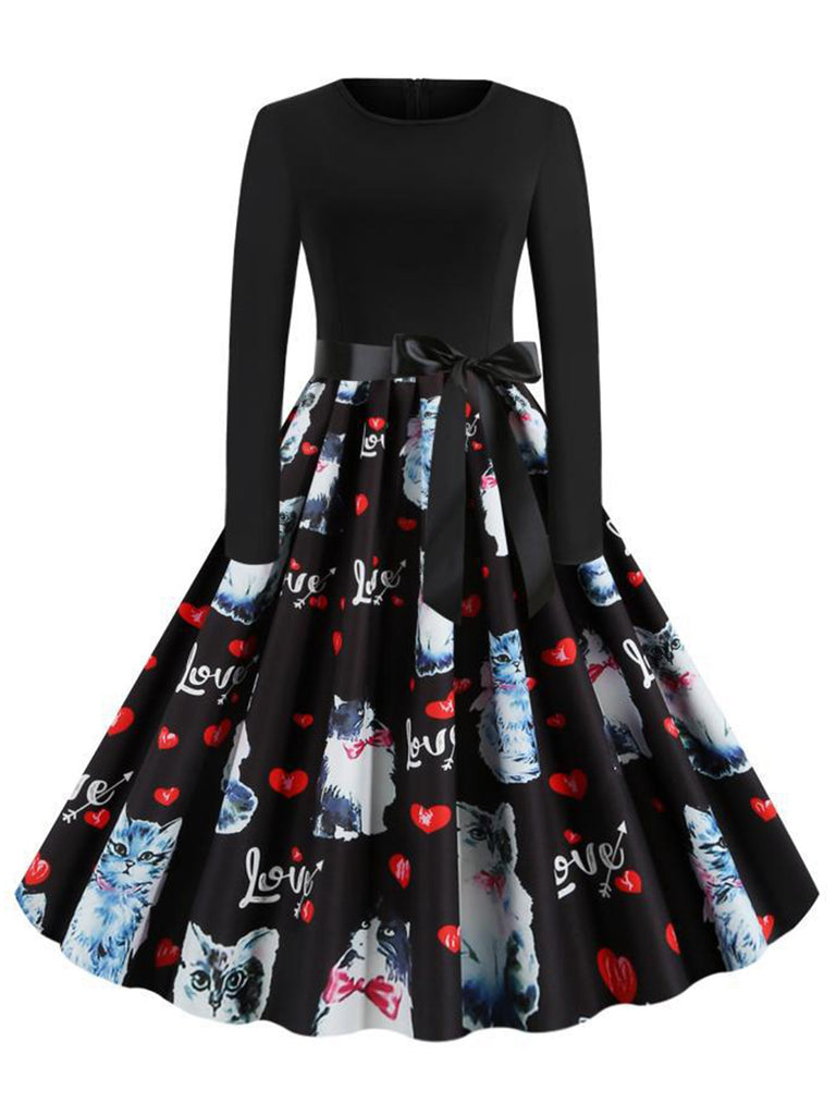 She slips into this Black 1950s Cat Heart Belted Dress and suddenly it's a 1950s daydream