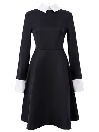 She slips into this Black 1950s Color Block Moderate Dress and suddenly it's a 1950s daydream