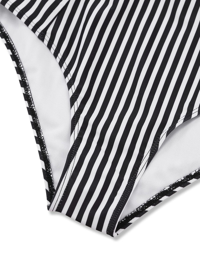 Close-up of a black and white striped fabric with a textured border.