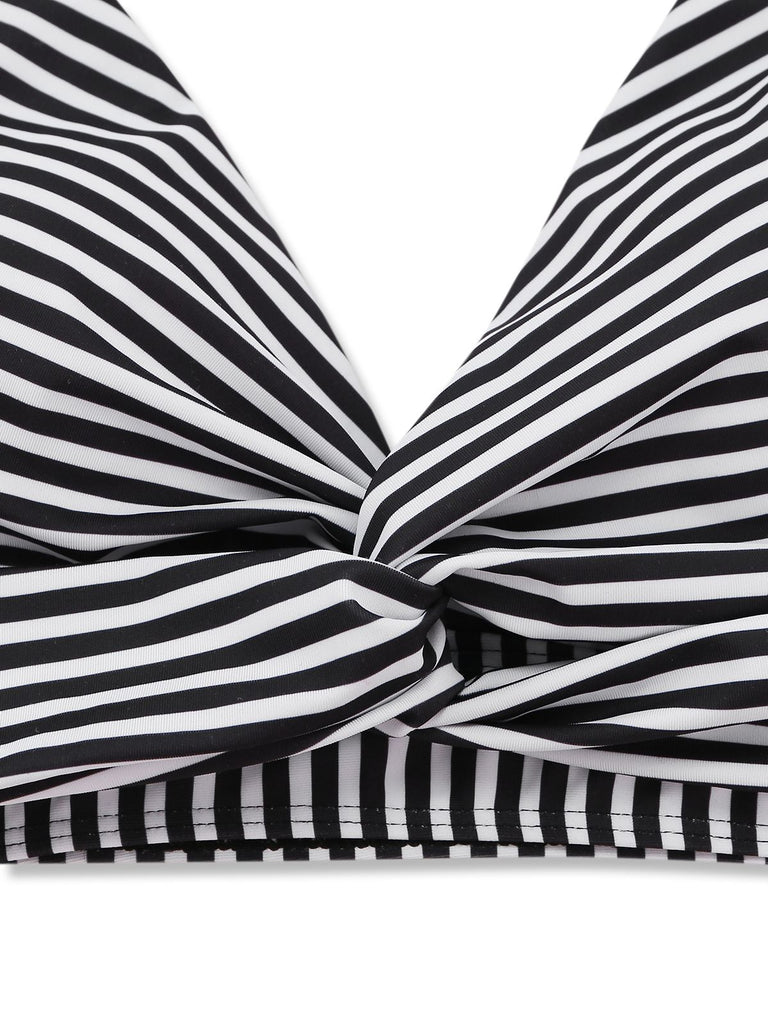 Black and white striped top with a bow detail on a white background