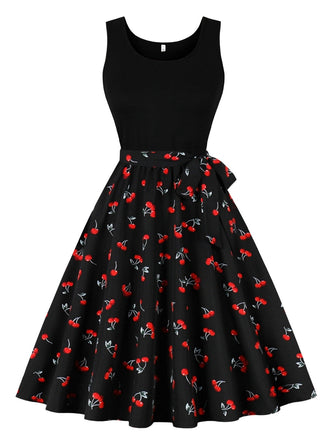 She slips into this Black 1950s Red Cherry Patchwork Swing Dress and suddenly it's a 1950s daydream