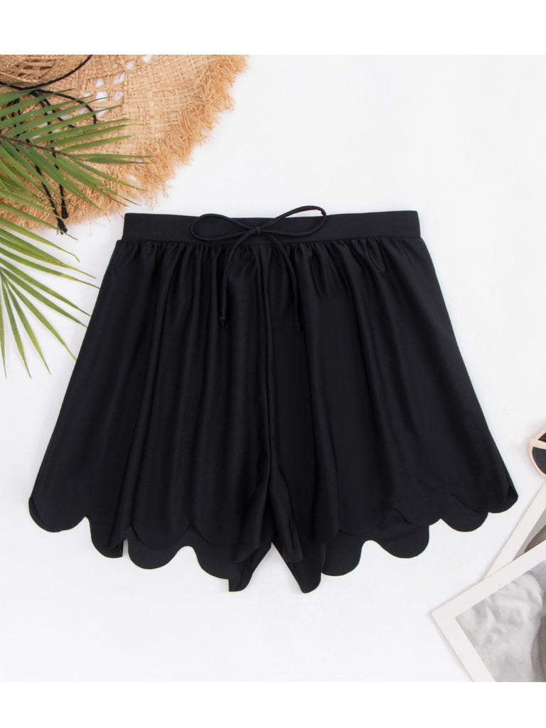 This Black 1950s Scallop Trim Solid Bikini Shorts carries 1950s vacation dreams in every stitch