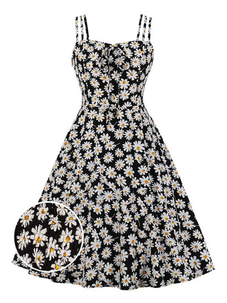 She slips into this Black 1950s Spaghetti Strap Daisy Dress and suddenly it's a 1950s daydream