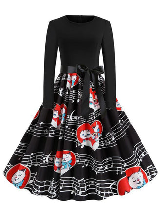 She slips into this Black 1950s Valentine Cats & Music Note Patchwork Dress and suddenly it's a 1950s daydream