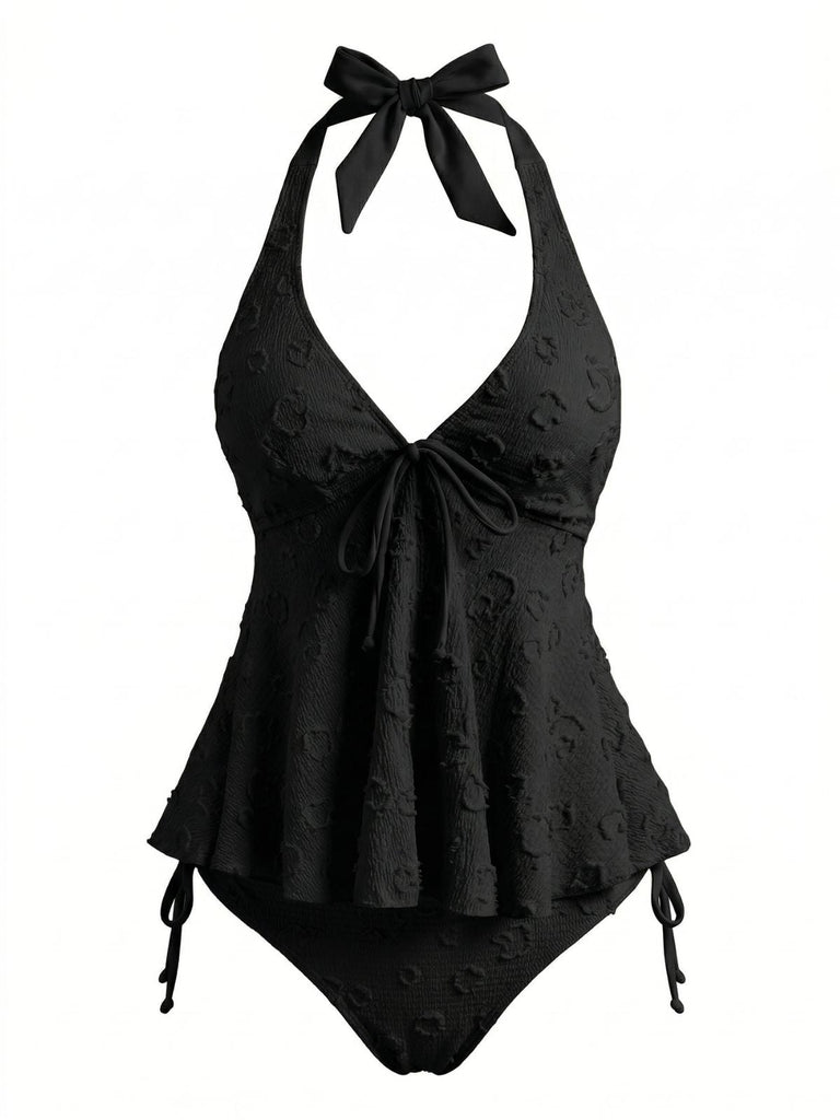 Retro 50s-style textured floral tankini featuring a plunging deep V-neck and halter straps for a classic beach look.