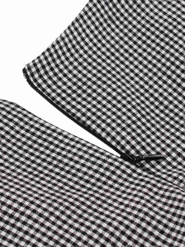 This Black 1960s Lapel Shepherd Check Patchwork Dress wraps her in 1960s elegance, one twirl at a time
