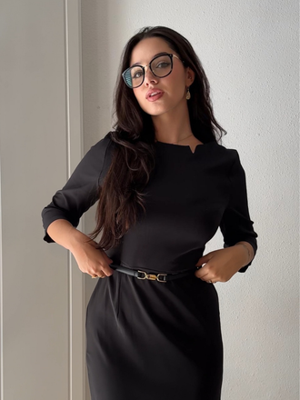 She slips into this Black 1960s Solid Boat Neck Wrap Dress and suddenly it's a 1960s daydream