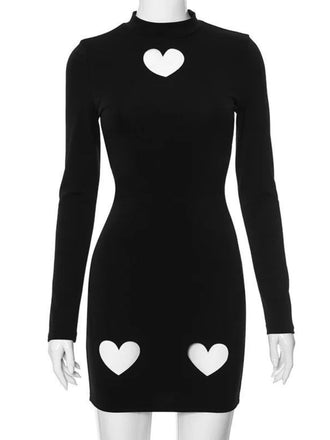 She slips into this Black 1960s Solid Heart Cut Out Dress and suddenly it's a 1960s daydream