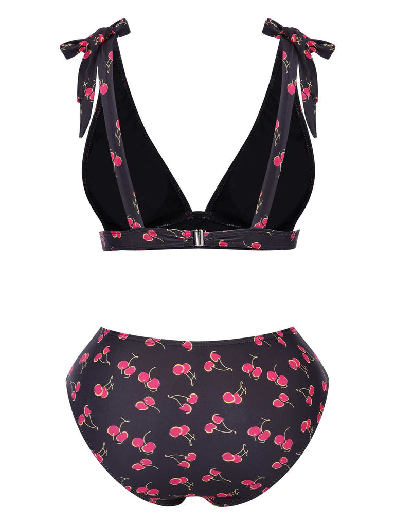 This Black 1960s Tie Strap Cherry Swimsuit carries 1960s vacation dreams in every stitch