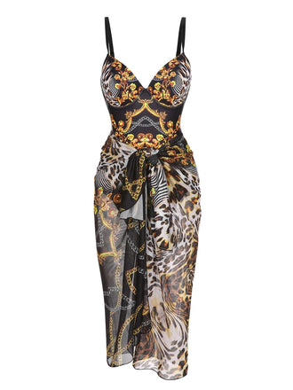 She's wearing Black 1970s Strap Print One-Piece Swimsuit & Cover-Up and the whole beach remembers the 1970s