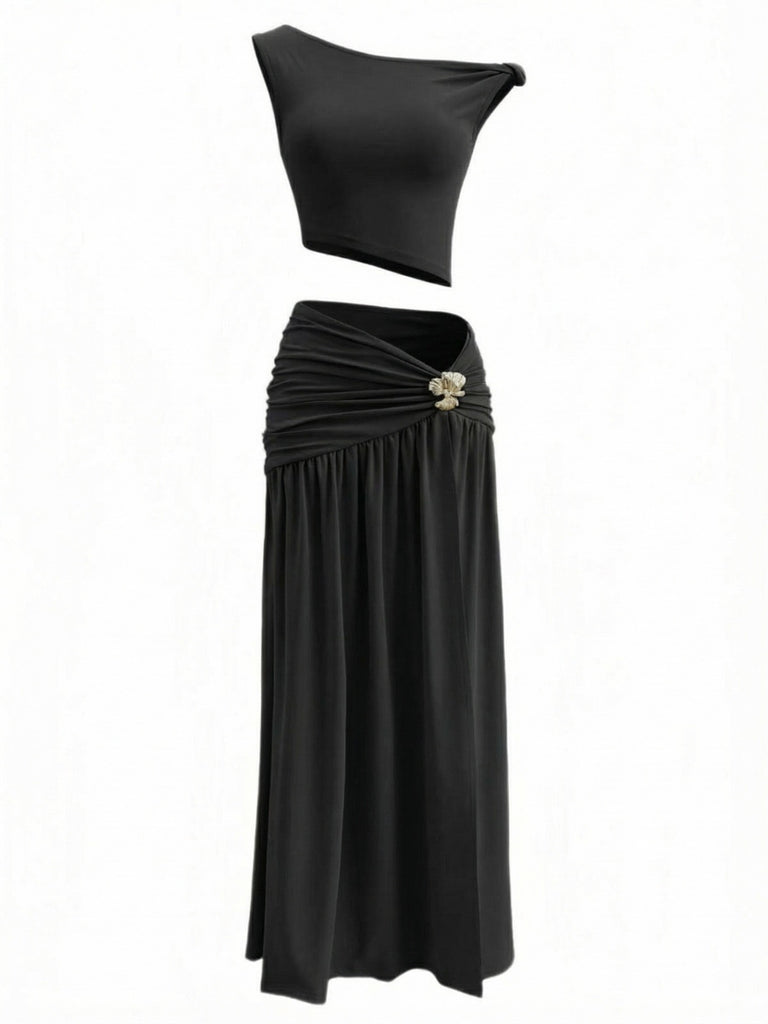 Black two-piece outfit with a top and skirt on a white background