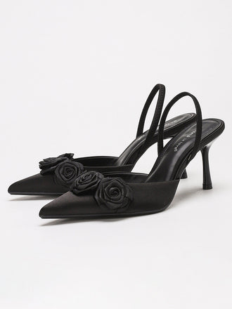 Elegant vintage pumps with a 3D rose detail and sharp pointed toe. A romantic choice for weddings or formal evening events.