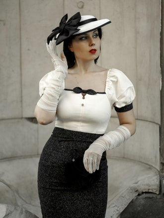 She slips into this Black & Beige 1960s Puff Sleeve Pencil Dress and suddenly it's a 1960s daydream