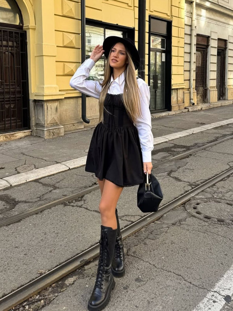 She slips into this Black Solid Sleeveless Lace Mini Dress and suddenly it's a vintage daydream