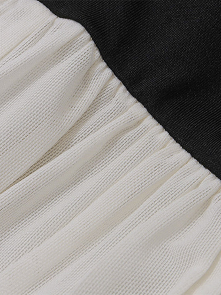 This Black & White 1950s Off-Shoulder Skater Dress wraps her in 1950s elegance, one twirl at a time