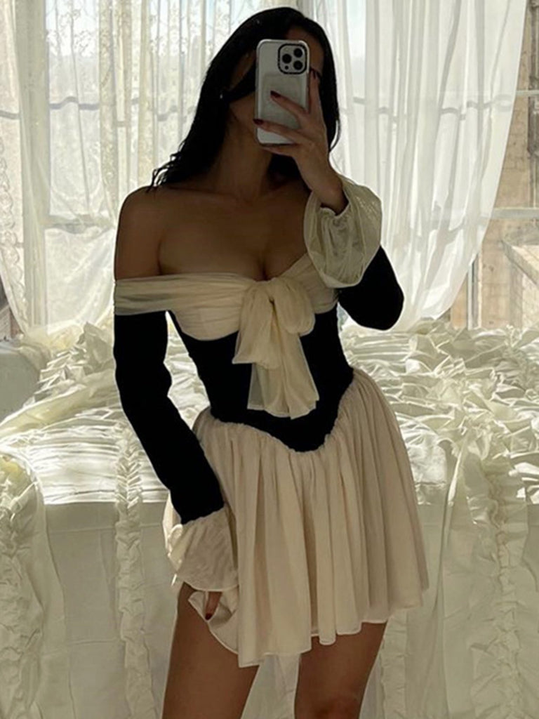 This Black & White 1950s Off-Shoulder Skater Dress wraps her in 1950s elegance, one twirl at a time