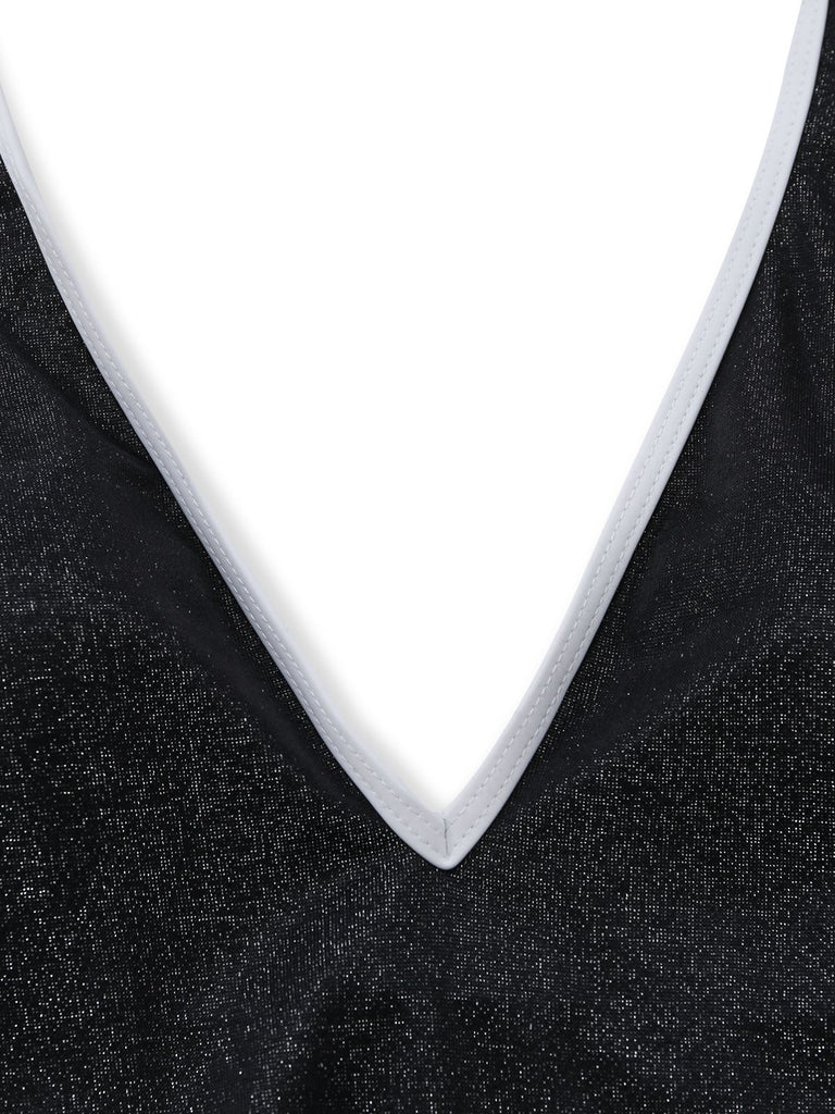 Close-up of a black textured fabric with a white trim