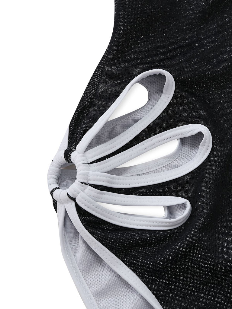 Close-up of a black and white shoe with a unique sole design on a white background