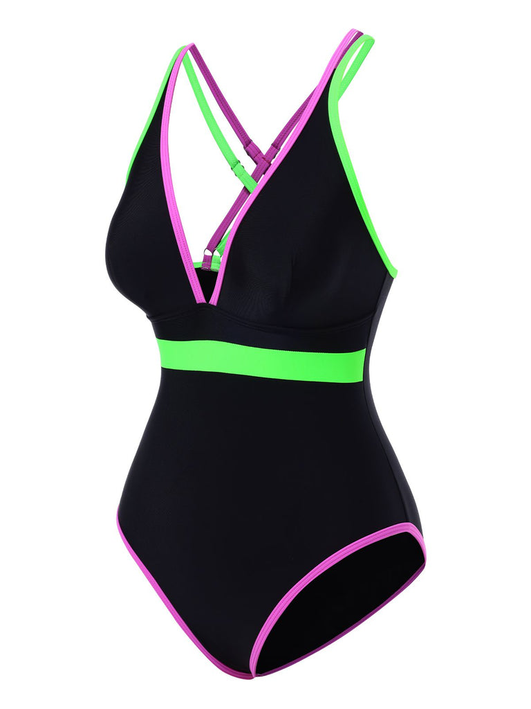 Black swimsuit with green and pink accents on a white background