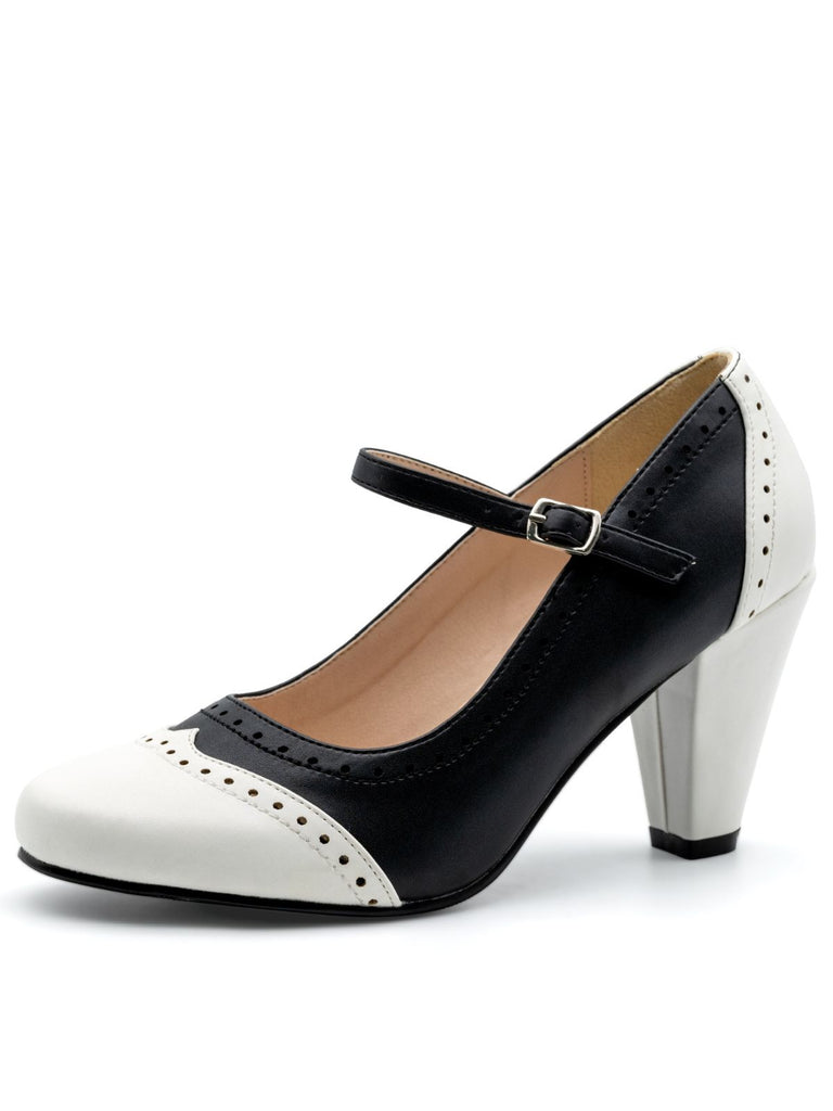 Black and white shoe with a strap on a white background