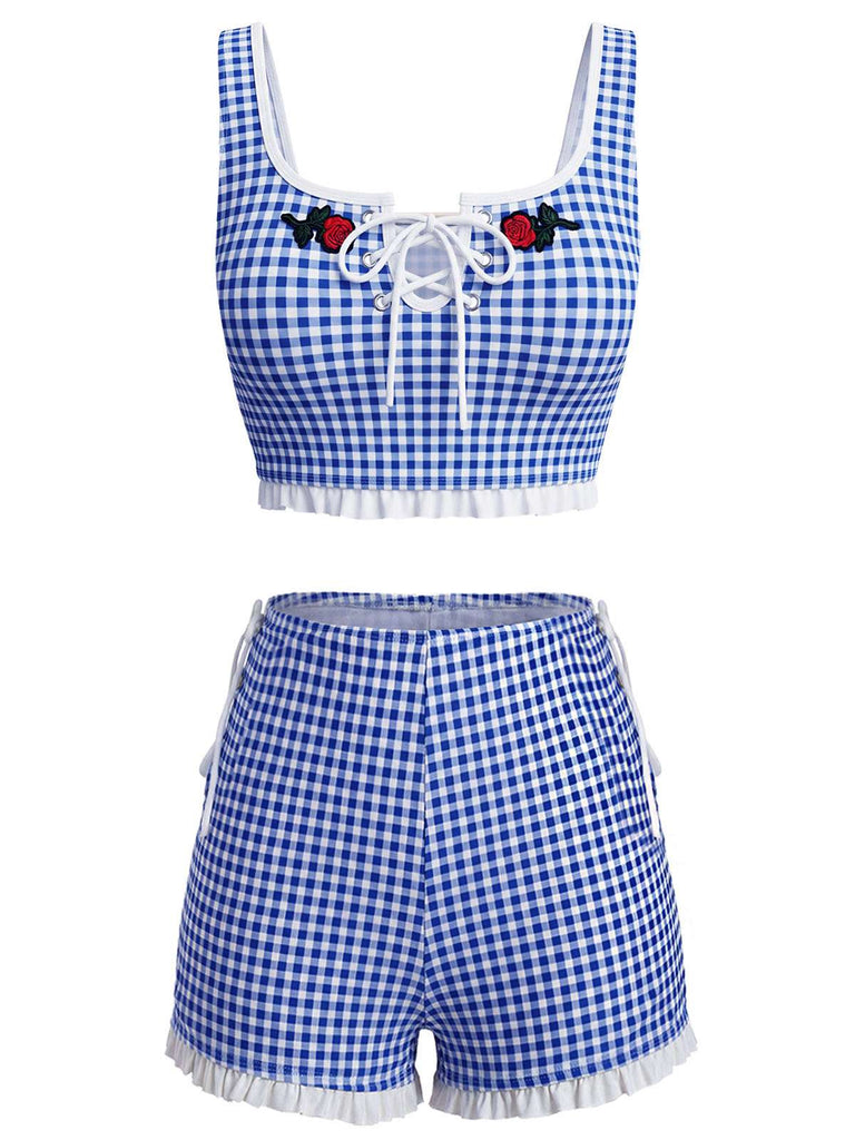 Blue and white checkered outfit with lace-up top and shorts on a white background