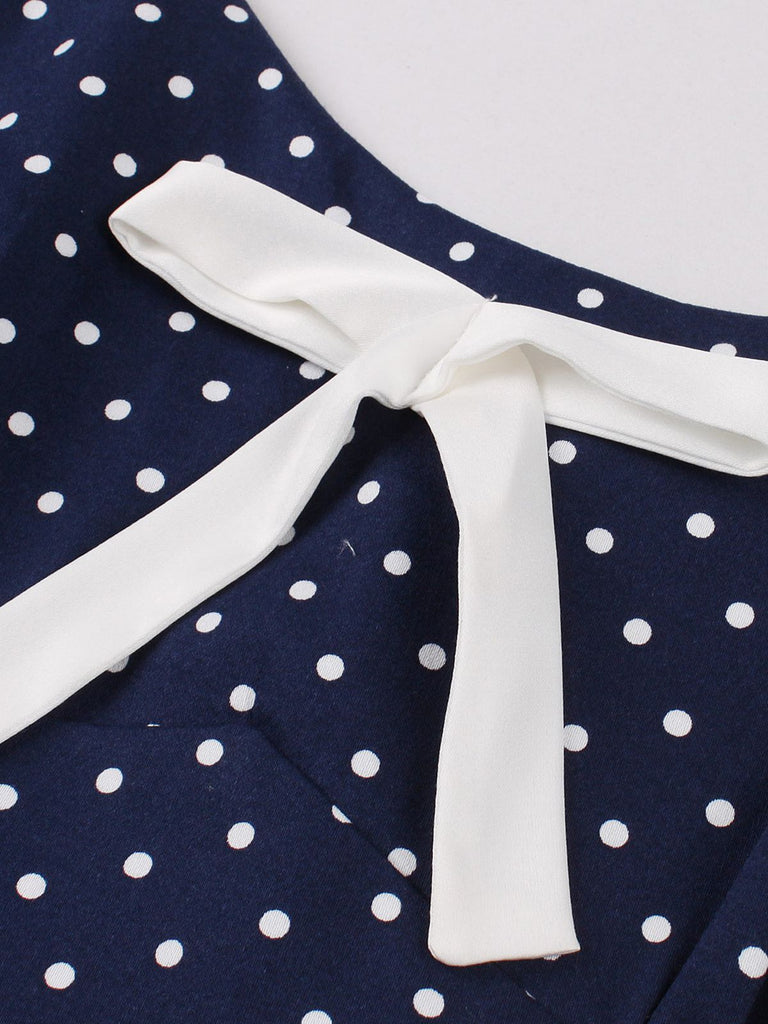 Blue 1940s Strap Polka Dot Bow Belted Dress — the kind of 1940s dress that makes strangers smile