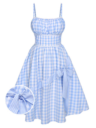 She slips into this Blue 1950s Spaghetti Strap Plaids Bow Decor Dress and suddenly it's a 1950s daydream