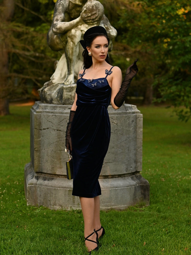 She slips into this Blue 1960s 3D Butterfly Velvet Pencil Dress and suddenly it's a 1960s daydream