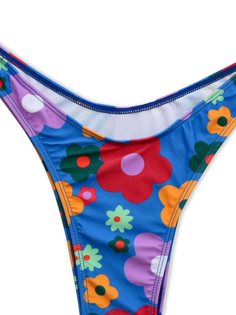 Blue 1960s Cartoon Floral Spaghetti Straps Swimsuit — because 1960s glamour never goes out of style