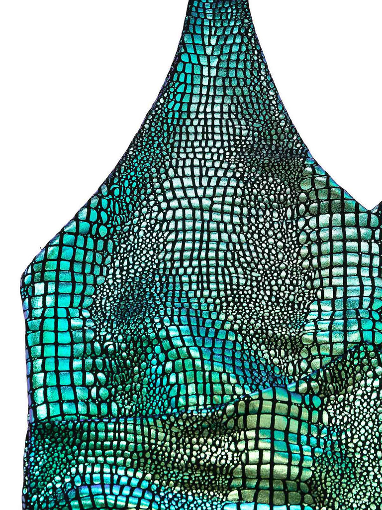 Close-up of a swimsuit with a green and black pattern on a white background