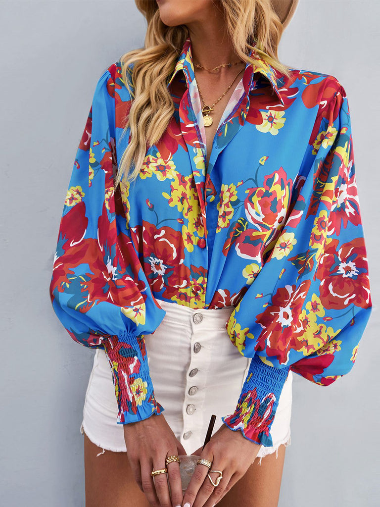 This Blue 1970s Contrast Floral Bishop Sleeve Blouse brings 1970s soul to her everyday
