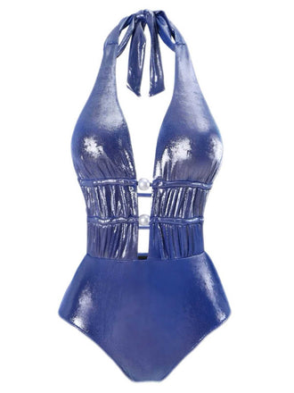 She's wearing Blue 1970s Shimmery Halter Pearl One-Piece Swimsuit and the whole beach remembers the 1970s