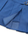 Close-up of a blue pleated skirt with a buckle on a white background