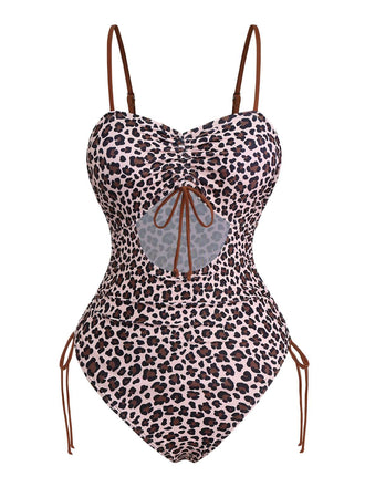She's wearing Brown 1940s Leopard Hollow Drawstring Swimsuit and the whole beach remembers the 1940s