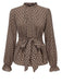 She pairs this Brown 1950s Ruffles Tie Waist Blouse with confidence and 1950s charm