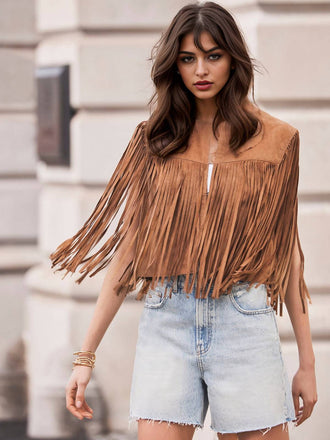 She finds her 1980s story in this Brown 1980s Western Fringe Cowgirl Vest