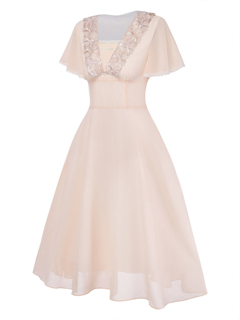 Beige dress with lace detailing on a white background