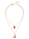 Necklace with cherry and strawberry pendants on a white background