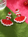 This Christmas Dress And Santa Hat Earrings wraps her in vintage elegance, one twirl at a time
