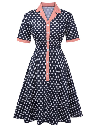 She slips into this Dark Blue 1950s Polka Dot Lapel Dress and suddenly it's a 1950s daydream