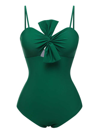 She's wearing Dark Green 1940s Bow Spaghetti Strap Swimsuit and the whole beach remembers the 1940s