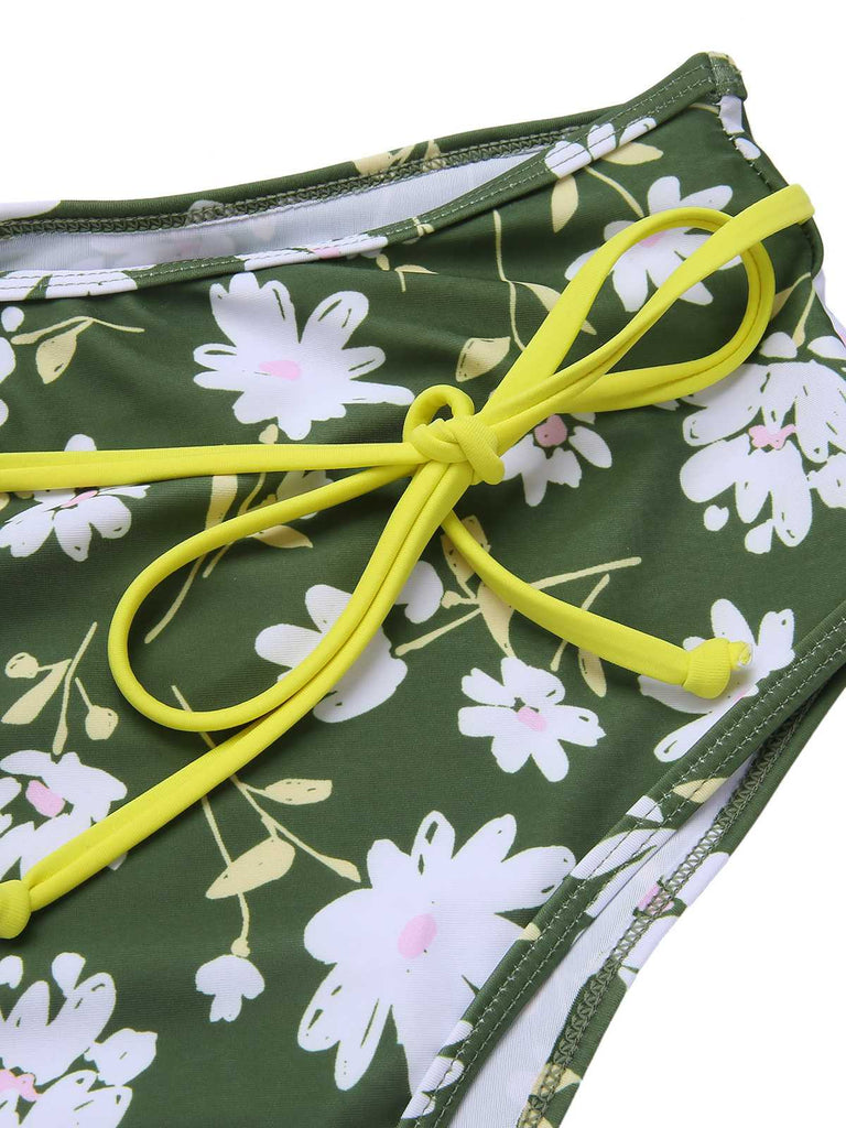 She's wearing Dark Green 1940s Halter Bow Floral Swimsuit and the whole beach remembers the 1940s