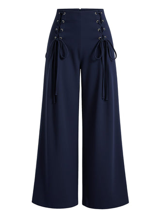 Navy blue wide-leg pants with lace-up details on a white background